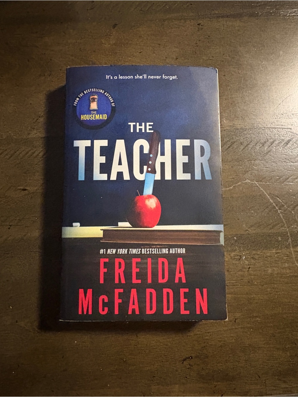 The Teacher by Freida McFadden - Dark Blue Cover with Red Accents